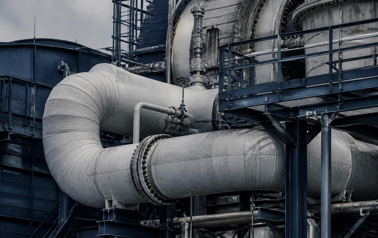 Insulated steam piping and steel walkways at a thermal generation plant